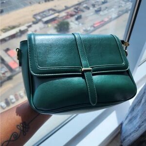 Green leather bag with gold hardware
